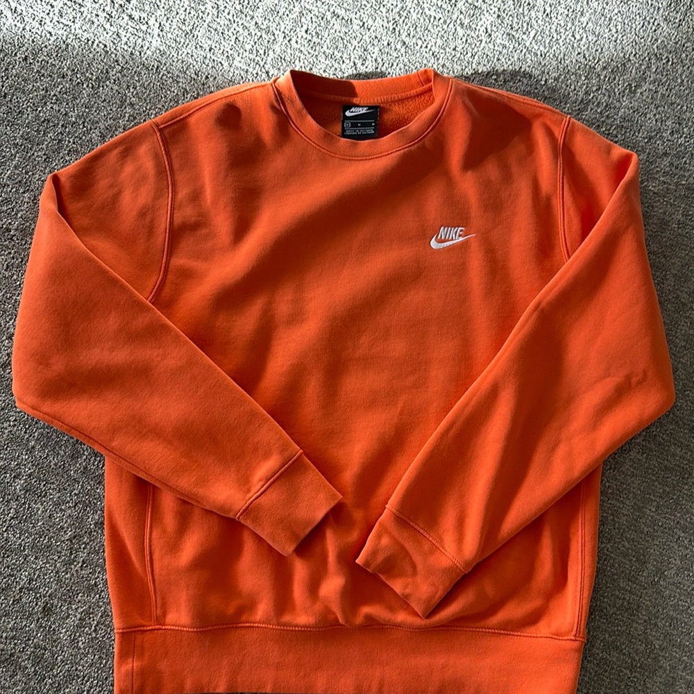 Bright orange Nike crewneck
